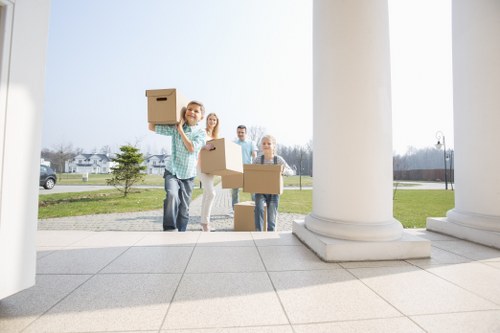Professional house removalists loading boxes in Hornsey
