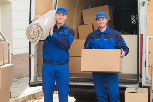 Professional removal team loading boxes in Hornsey