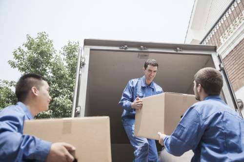 Moving team handling furniture with care during transport