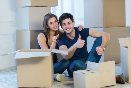 Safety-focused moving team checking access before lifting