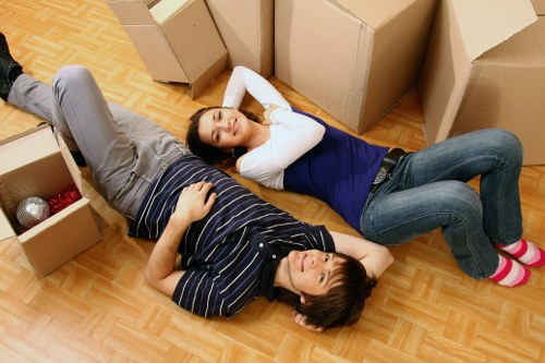 Staff carrying furniture with protected floors and doorways