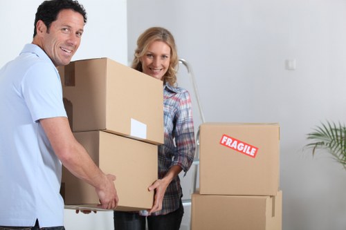 Moving day in Hornsey with boxes, furniture, and a removals van