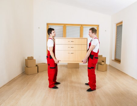 Professional movers loading furniture during Hornsey house removals